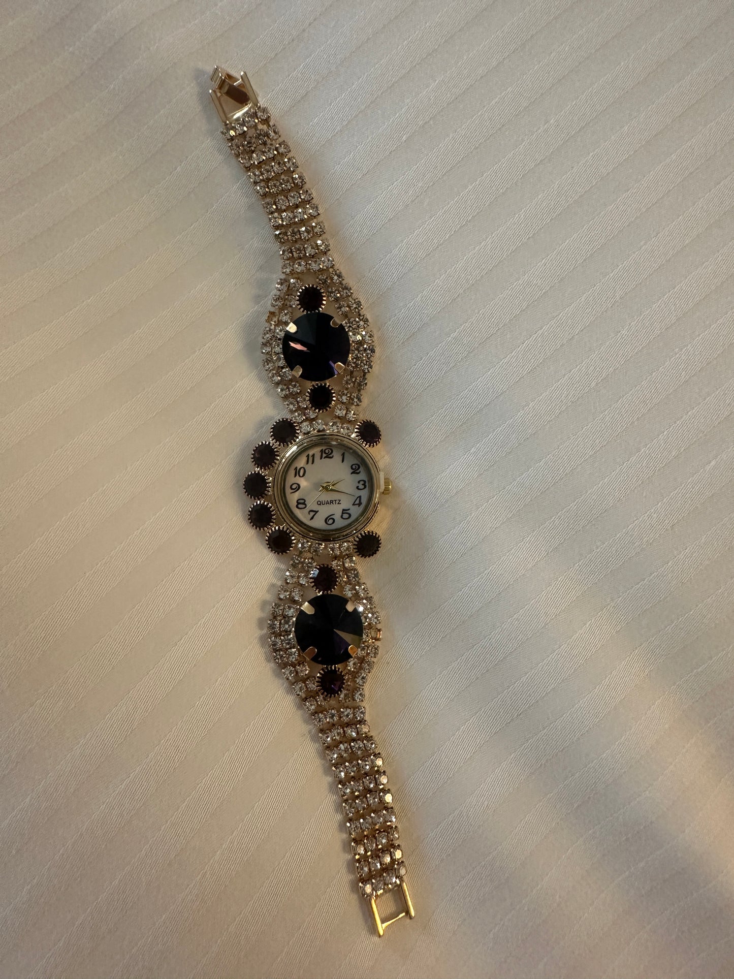 Gold and purple strap watch