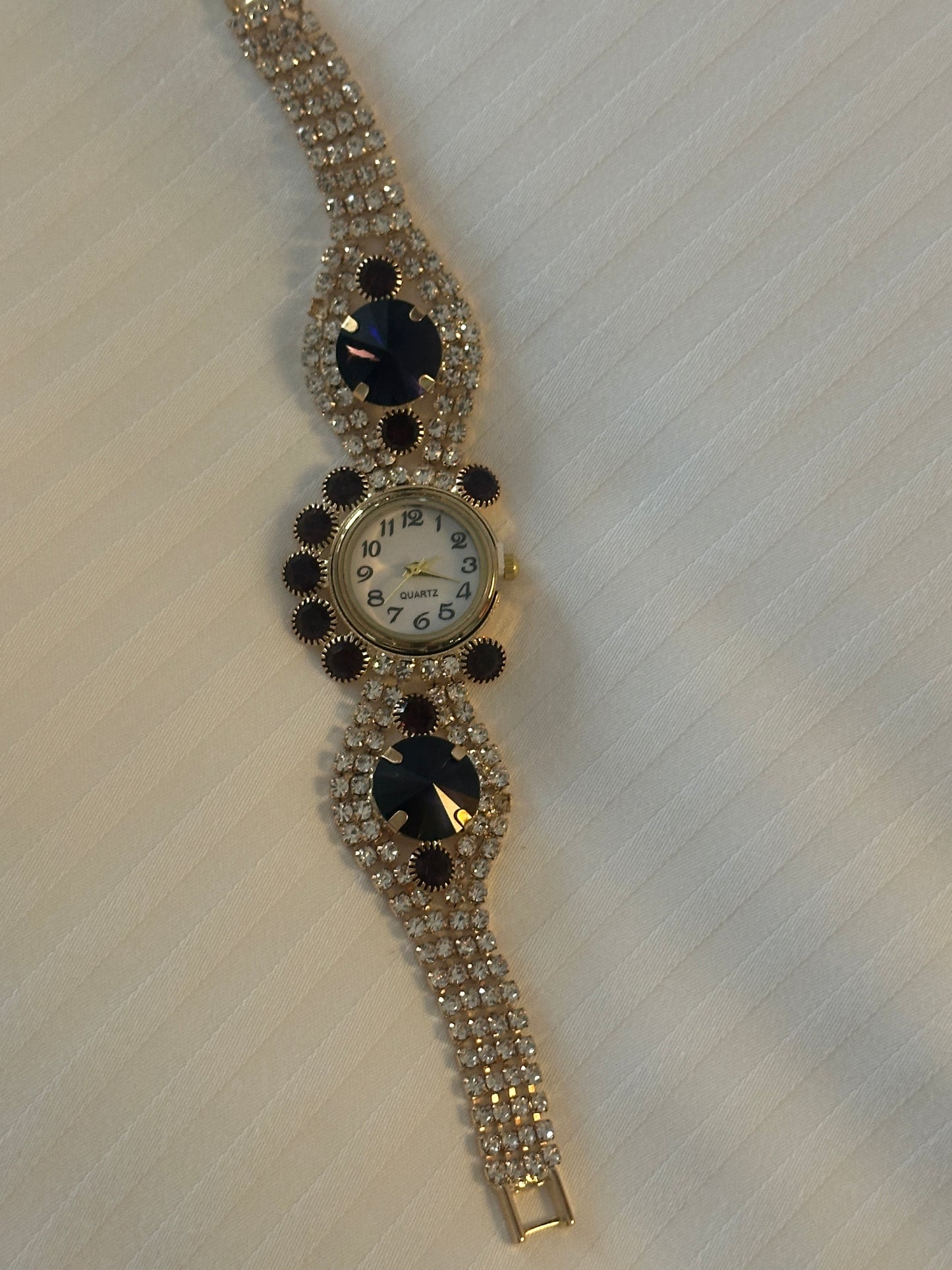 Gold and purple strap watch