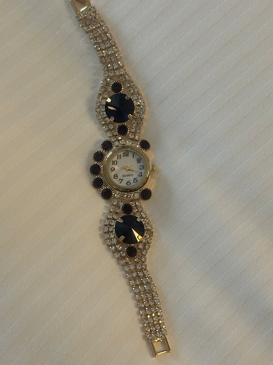 Gold and purple strap watch