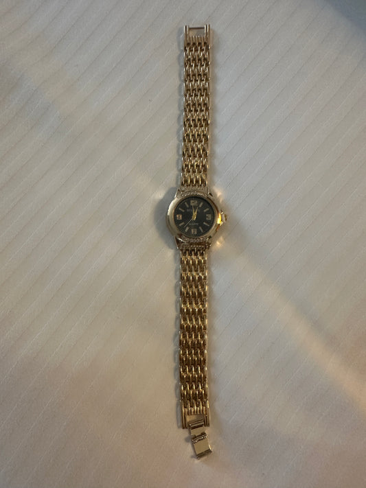 Gold and black strap watch