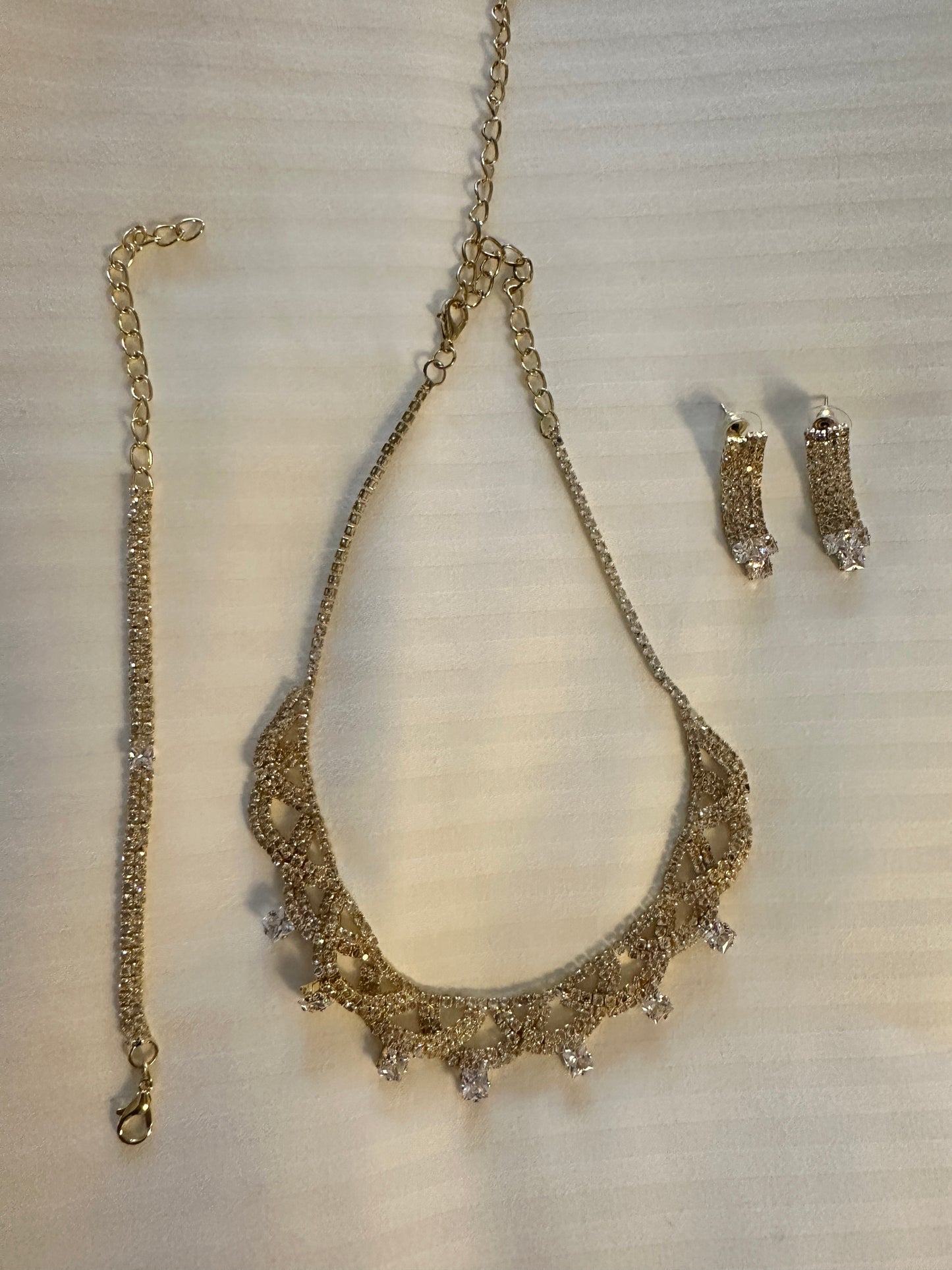 Gold earrings bracelet and necklace set