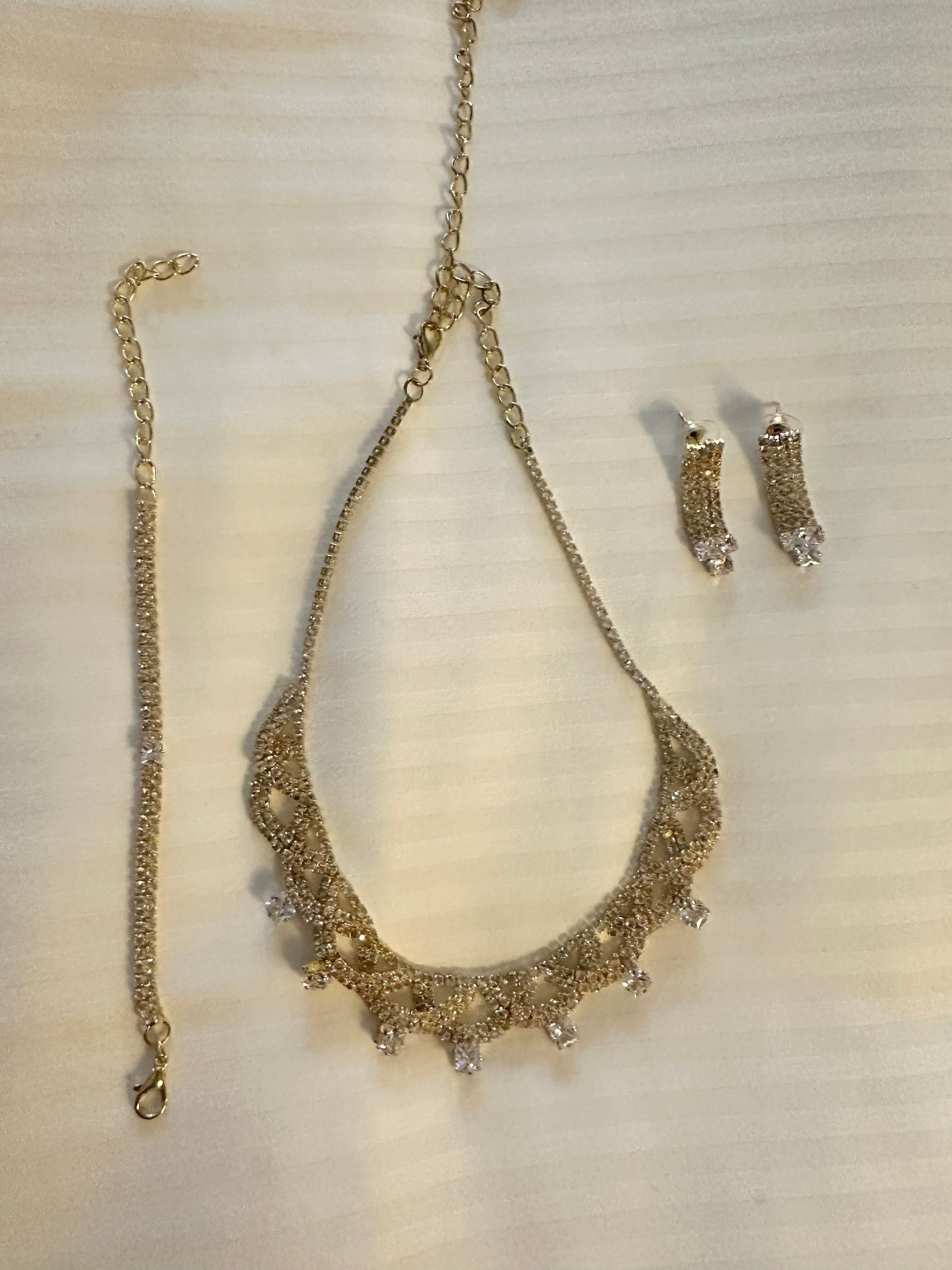 Gold earrings bracelet and necklace set