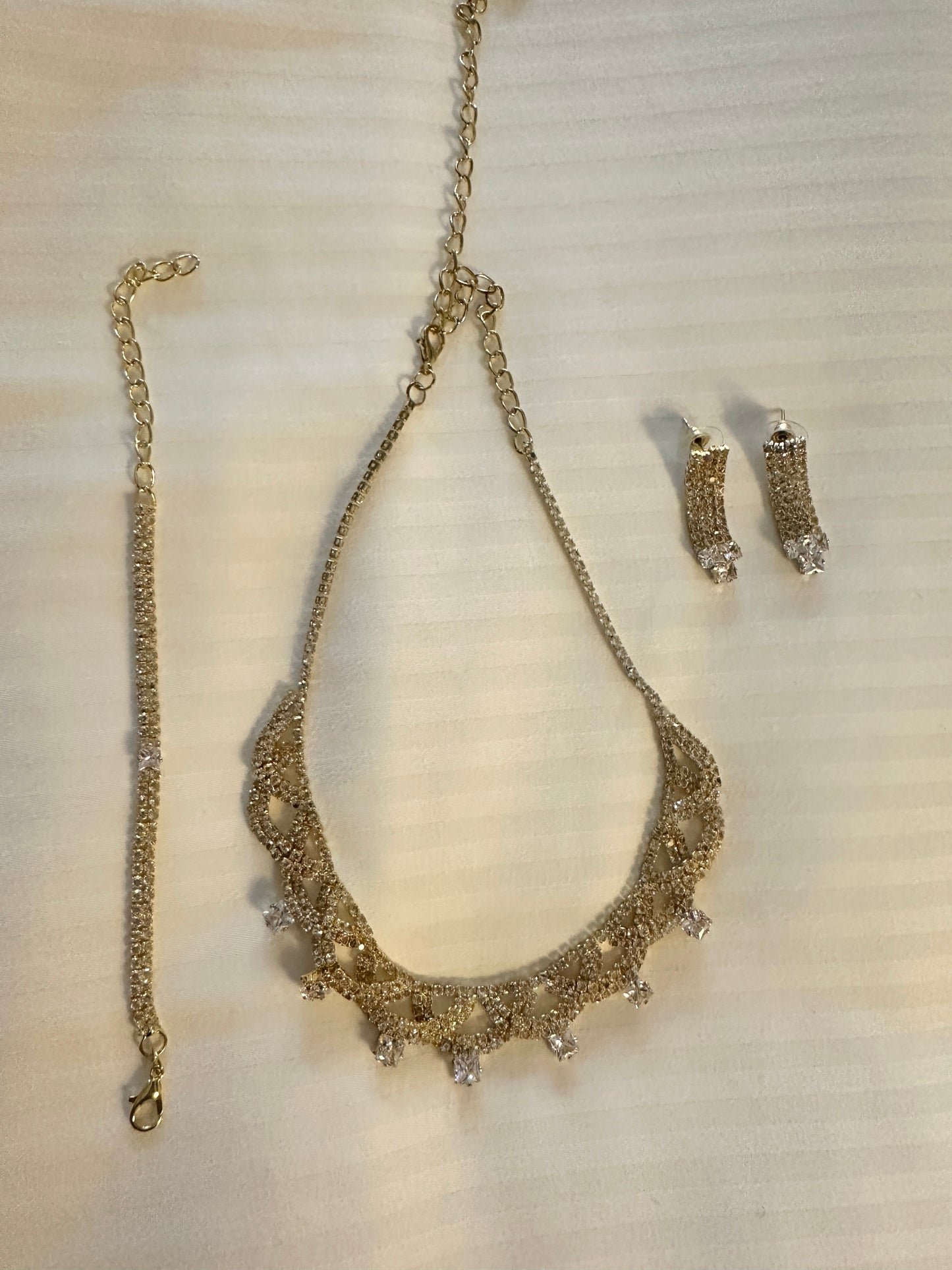 Gold earrings bracelet and necklace set