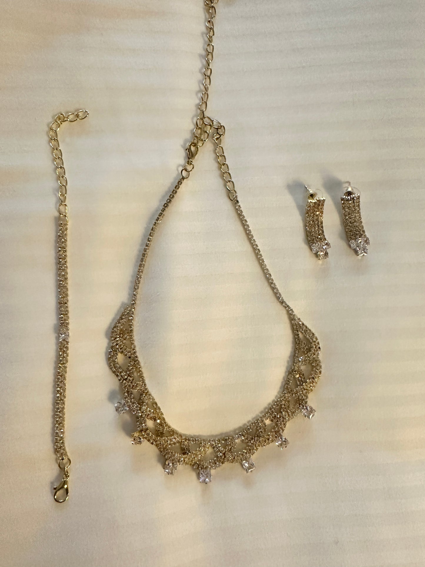 Gold earrings bracelet and necklace set